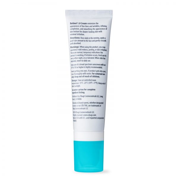 A tube of face cream with blue cap.