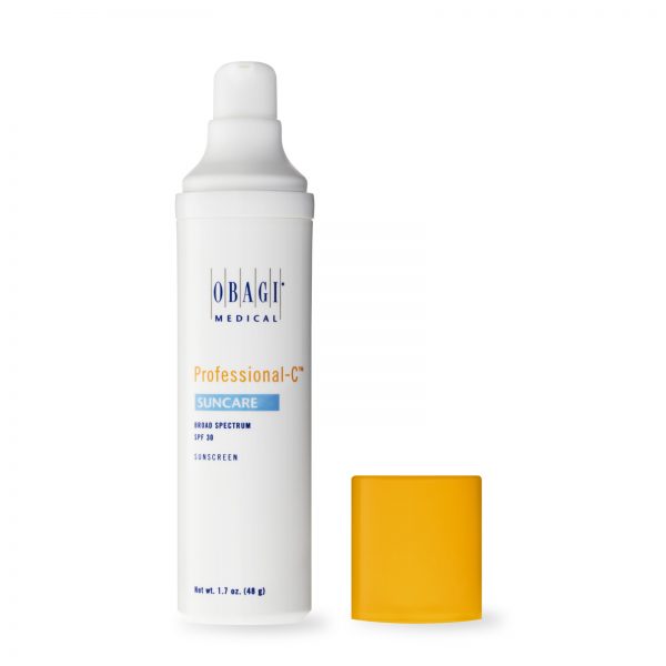 A bottle of sunscreen next to a yellow block.